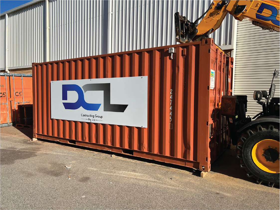 Custom signage installed on an industrial site or sea container